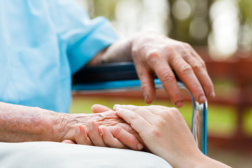 Image of older person being cared for