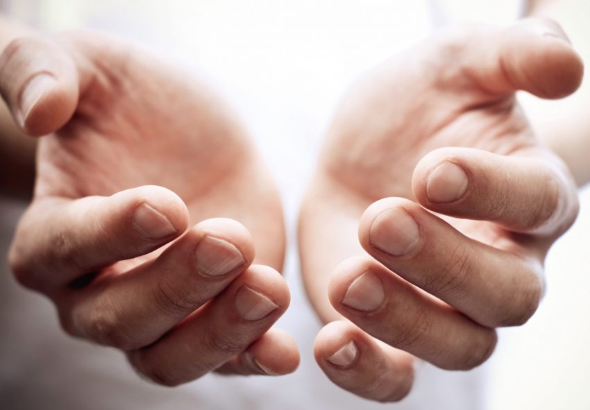 Charity image of someone holding out hands