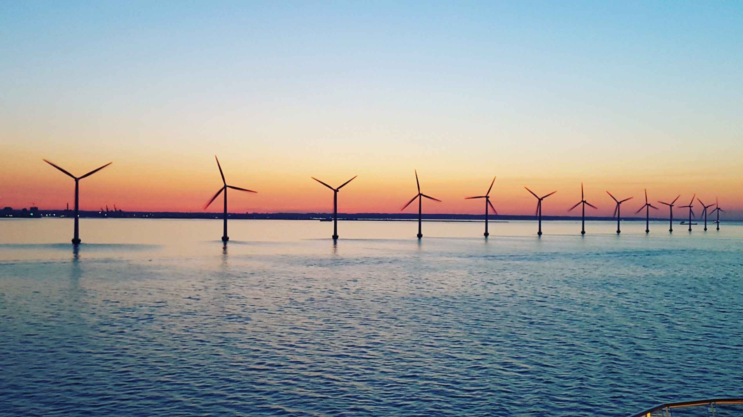 Wind turbines in ocean for green energy, an ESG initiative